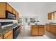 Spacious kitchen featuring stainless steel appliances, granite countertops, a center island, and abundant cabinet space at 4178 Mcever Park Dr, Acworth, GA 30101