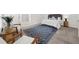 Cozy primary bedroom featuring a large blue rug, bright neutral walls, and two stylish chairs at 4178 Mcever Park Dr, Acworth, GA 30101