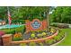 McEver Park neighborhood entrance sign with lush landscaping and the community pool in the background at 4178 Mcever Park Dr, Acworth, GA 30101