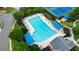 Overhead view of a community pool with lounge chairs and shade covers, surrounded by lush landscaping at 4312 Shillham Ct, Cumming, GA 30040