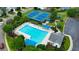 Aerial view of a community pool, tennis courts, and landscaped common areas in a residential neighborhood at 4312 Shillham Ct, Cumming, GA 30040