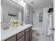 Bathroom featuring double sinks, a tub, and modern fixtures at 4312 Shillham Ct, Cumming, GA 30040