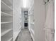 Walk-in closet providing ample storage space with custom shelving and hanging racks at 4312 Shillham Ct, Cumming, GA 30040