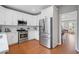 Modern kitchen with stainless appliances and white cabinetry, ideal for cooking at 4312 Shillham Ct, Cumming, GA 30040