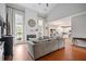 Open floor plan showcasing a living room with fireplace and a view into the modern kitchen at 4312 Shillham Ct, Cumming, GA 30040