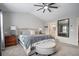 Spacious main bedroom with plush carpeting, vaulted ceilings, and an ensuite bathroom at 4312 Shillham Ct, Cumming, GA 30040