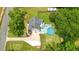 Aerial shot of a home showcasing a fenced backyard with a pool and deck area, with well-manicured lawn at 117 Village Ct, Woodstock, GA 30188