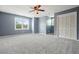 Spacious bedroom with carpet, natural light, and a view of the outside at 117 Village Ct, Woodstock, GA 30188