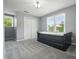 Bedroom featuring carpet floors, two windows with blinds, and closet with paneled doors at 117 Village Ct, Woodstock, GA 30188