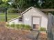Charming chicken coop with a detailed design and fenced enclosure, adding character to the backyard at 117 Village Ct, Woodstock, GA 30188