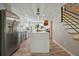 Bright and updated kitchen with stainless steel appliances, white cabinets, and wood accents at 117 Village Ct, Woodstock, GA 30188