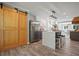 Beautiful renovated kitchen with stainless steel appliances, granite countertops, and stylish lighting at 117 Village Ct, Woodstock, GA 30188