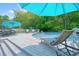 Inviting backyard pool area with lounge chairs, deck, and lush landscaping at 117 Village Ct, Woodstock, GA 30188