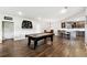 A spacious basement area provides room for a pool table, bar seating, and a full kitchen at 5070 Laurel Ridge Dr, Cumming, GA 30040