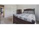 Comfortable bedroom featuring a bed with plush pillows, spacious closet, and soft carpeting, for relaxation at 5070 Laurel Ridge Dr, Cumming, GA 30040