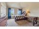 Inviting bedroom with natural light, a desk, and an inviting bed, creating a warm and functional space at 5070 Laurel Ridge Dr, Cumming, GA 30040