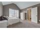 Tranquil bedroom with sloped ceiling, large window, and closet access, blending comfort and functionality at 5070 Laurel Ridge Dr, Cumming, GA 30040