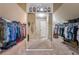 Spacious walk-in closet featuring custom shelving and ample storage space for clothing and accessories at 5070 Laurel Ridge Dr, Cumming, GA 30040