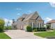 Charming two-story home showcasing a side view with a driveway and basketball hoop at 5070 Laurel Ridge Dr, Cumming, GA 30040