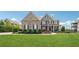 Beautiful two-story brick home with a well-manicured lawn and landscaping at 5070 Laurel Ridge Dr, Cumming, GA 30040