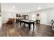 Entertainment room with a pool table, a wet bar, and a seating area, perfect for hosting and recreation at 5070 Laurel Ridge Dr, Cumming, GA 30040