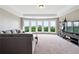 Bright living room featuring a bay window with views, neutral tones, and lots of natural light at 5070 Laurel Ridge Dr, Cumming, GA 30040