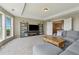 Cozy living room with neutral tones, lots of seating, and a large window at 5070 Laurel Ridge Dr, Cumming, GA 30040