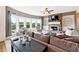Cozy living room showcases a fireplace, large windows, comfortable seating, and built-in shelving at 5070 Laurel Ridge Dr, Cumming, GA 30040