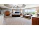 Large main bedroom with a trey ceiling, sitting area, and lots of natural light at 5070 Laurel Ridge Dr, Cumming, GA 30040