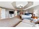 Spacious main bedroom with sitting area and large windows, complete with trey ceiling at 5070 Laurel Ridge Dr, Cumming, GA 30040