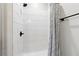Modern shower with white subway tile and a sleek, dark-colored showerhead at 5070 Laurel Ridge Dr, Cumming, GA 30040