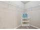 A walk-in closet with carpet floors, wire shelving, and a corner storage unit provides ample space for storage at 5070 Laurel Ridge Dr, Cumming, GA 30040