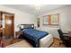 Bedroom features wood floors, natural light, and simple furnishings at 945 Blackwell Rd, Marietta, GA 30066