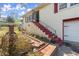 Exterior view showing a red staircase, red shutters and manicured landscape at 945 Blackwell Rd, Marietta, GA 30066