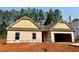 New construction home featuring a two-car garage and neutral siding at 486 Charleston Pl, Villa Rica, GA 30180