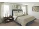 Stylish bedroom with a comfy bed, wooden nightstands, and natural light from windows at 507 Regency Trl, Acworth, GA 30102