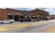 Downtown storefronts of red brick buildings featuring shops and businesses along the street at 507 Regency Trl, Acworth, GA 30102