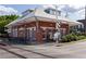 Red brick train depot with a gray roof and covered platform next to train tracks at 507 Regency Trl, Acworth, GA 30102