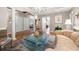 Well-lit living room with hardwood floors, modern furnishings, and open doorway at 1735 Peachtree Ne St # 316, Atlanta, GA 30309