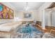 Elegant living room featuring a chandelier, modern art, and stylish furniture at 1735 Peachtree Ne St # 316, Atlanta, GA 30309