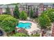 Aerial shot showcasing the community pool and lounge area in a red brick condo building at 1735 Peachtree Ne St # 316, Atlanta, GA 30309