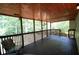 Spacious screened-in porch with a wooded view, perfect for enjoying the outdoors at 188 Thornbrooke Dr, Hiram, GA 30141