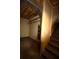 Basement stairs leading to a storage room with open shelving at 188 Thornbrooke Dr, Hiram, GA 30141