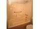 Bathroom featuring shower and tub combination with safety hand rails at 188 Thornbrooke Dr, Hiram, GA 30141