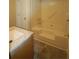 Bathroom featuring a tub, vanity and sink, and laminate floor at 188 Thornbrooke Dr, Hiram, GA 30141