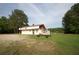 Commercial building with large gravel parking area, yard and lake view at 188 Thornbrooke Dr, Hiram, GA 30141