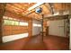 Spacious garage featuring an automatic garage door and room for storage at 188 Thornbrooke Dr, Hiram, GA 30141