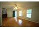 Bright living room with hardwood floors, a ceiling fan, and a welcoming front door at 188 Thornbrooke Dr, Hiram, GA 30141