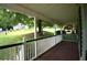 Relaxing covered front porch with views of the landscaped yard and neighboring homes at 188 Thornbrooke Dr, Hiram, GA 30141