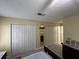 Spacious bedroom featuring double closets and neutral color scheme, offers ample storage and natural light at 2529 Feathertree Ln, Lawrenceville, GA 30044